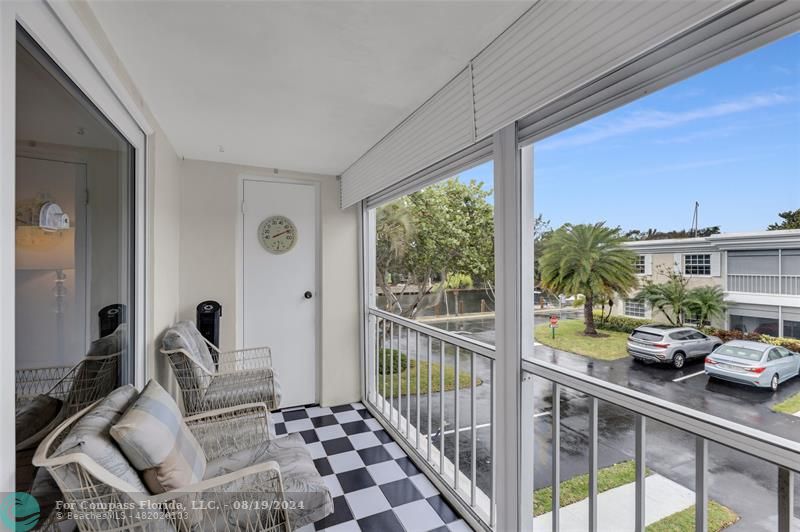 a view of a living room and a balcony