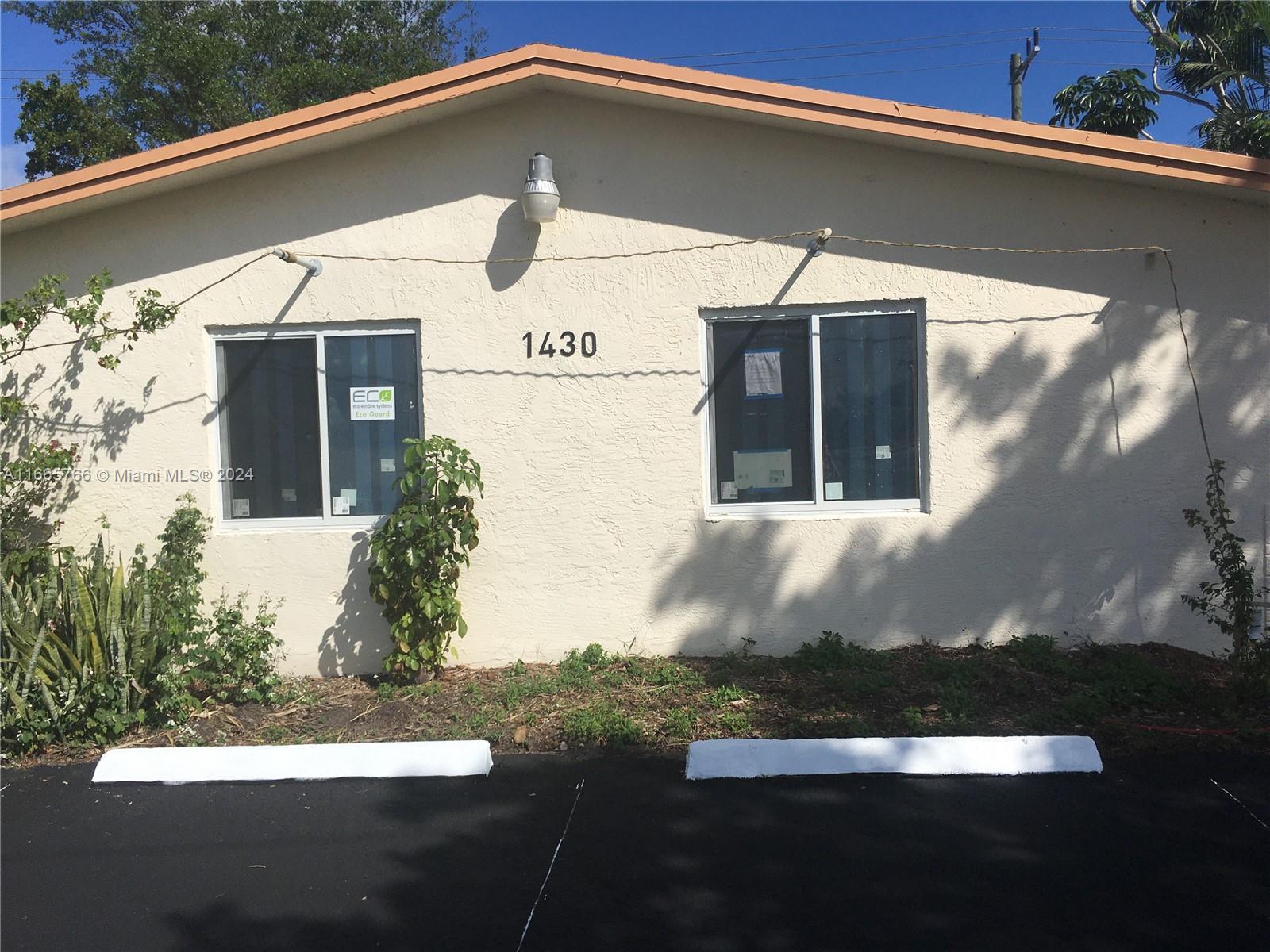 a front view of a house with yard