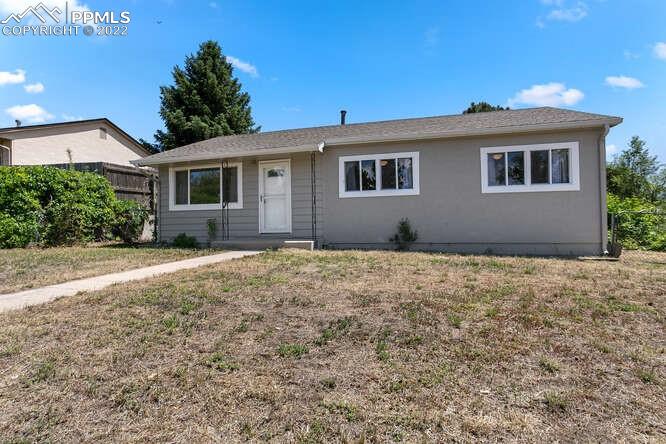 a house with trees in front of it