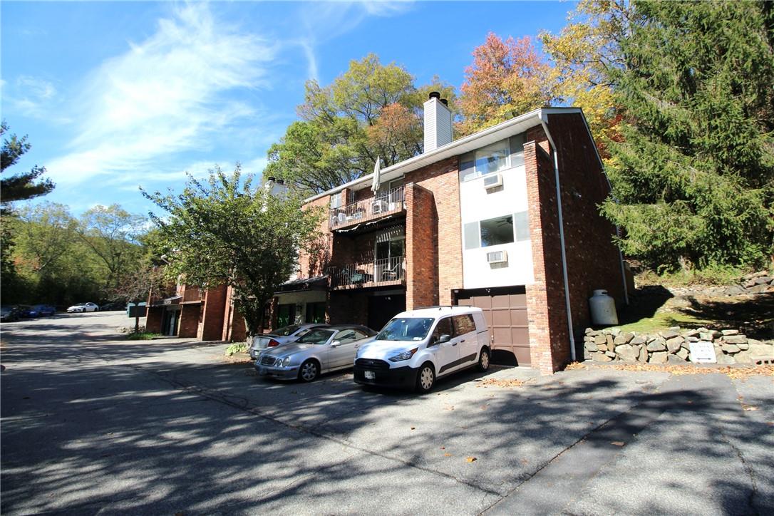 View of property with a garage