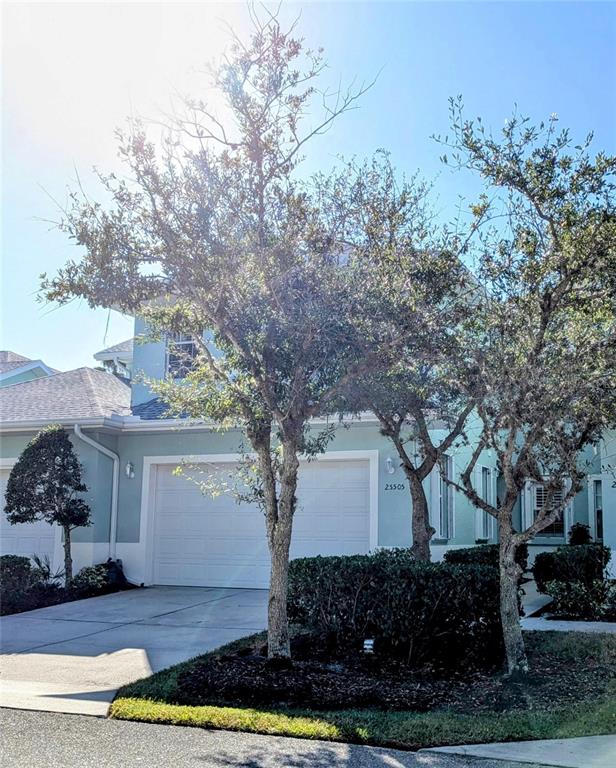 a front view of a house with trees