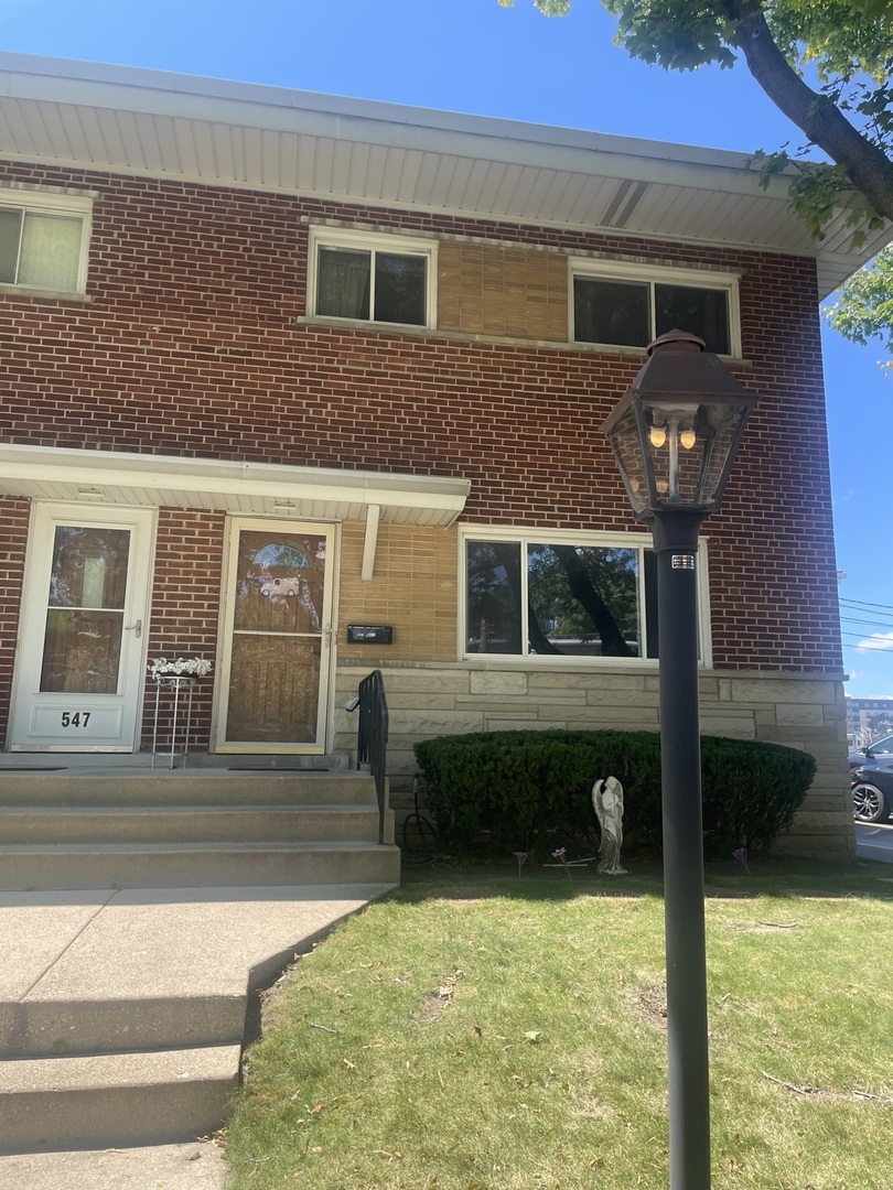 a view of house with yard