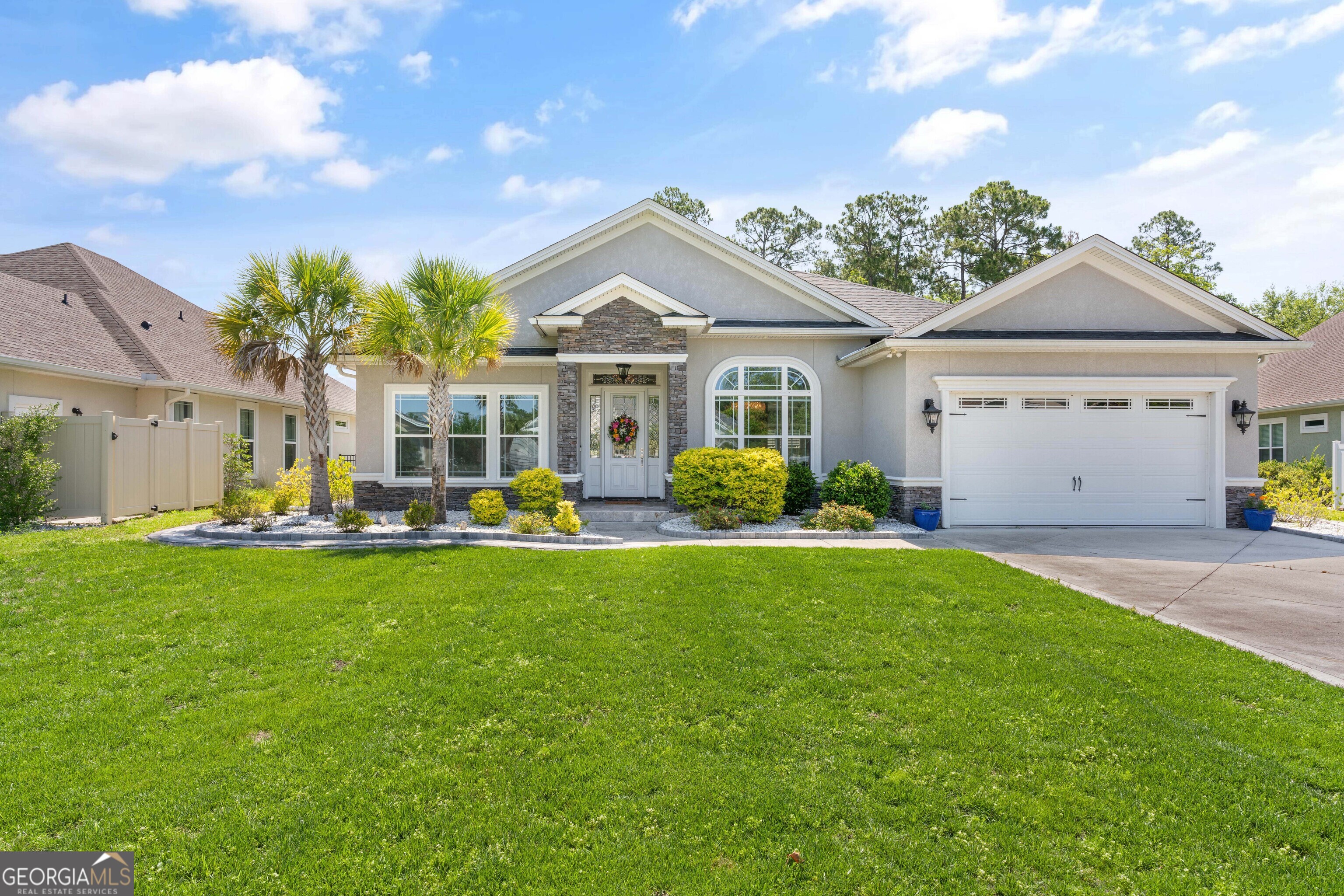 a front view of a house with swimming pool having outdoor seating