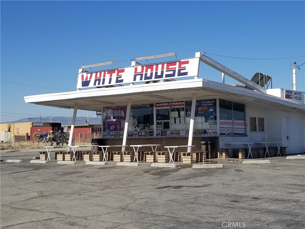 a view of a cafe with sitting area