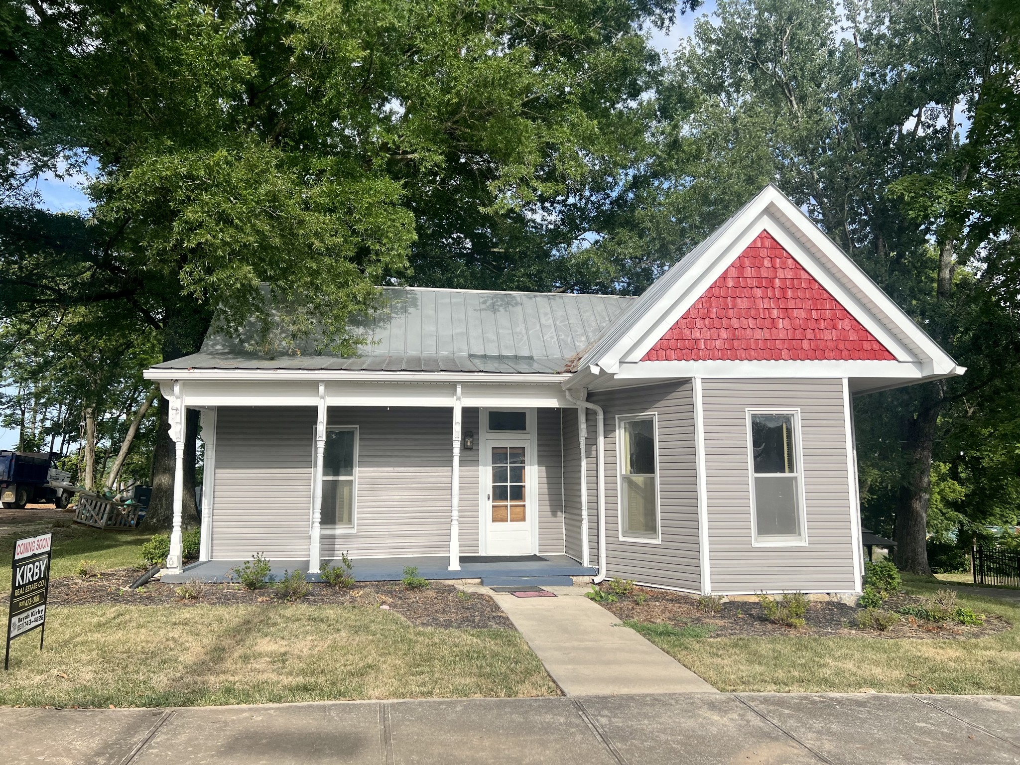 a front view of a house with garden