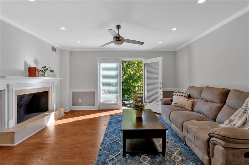 a living room with furniture fireplace and window