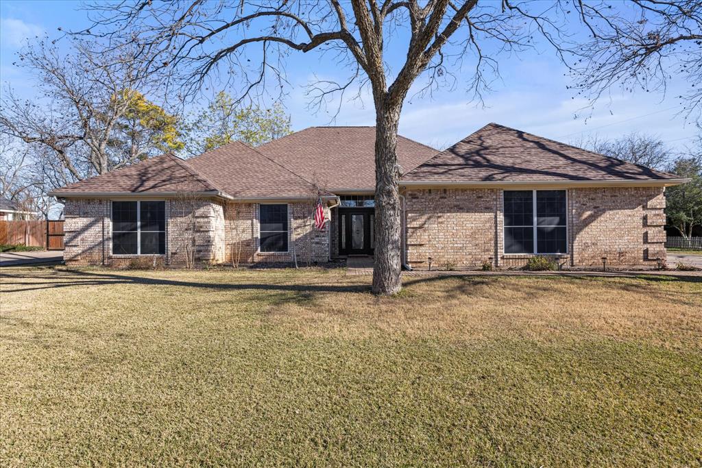 a house with trees in the background