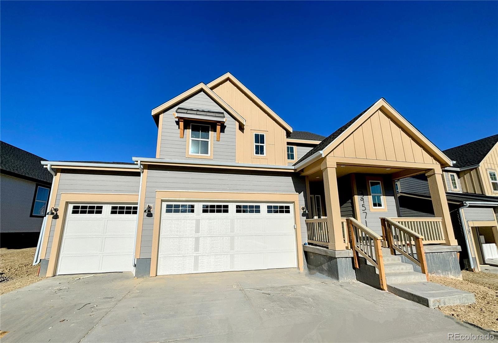 a front view of a house with garage