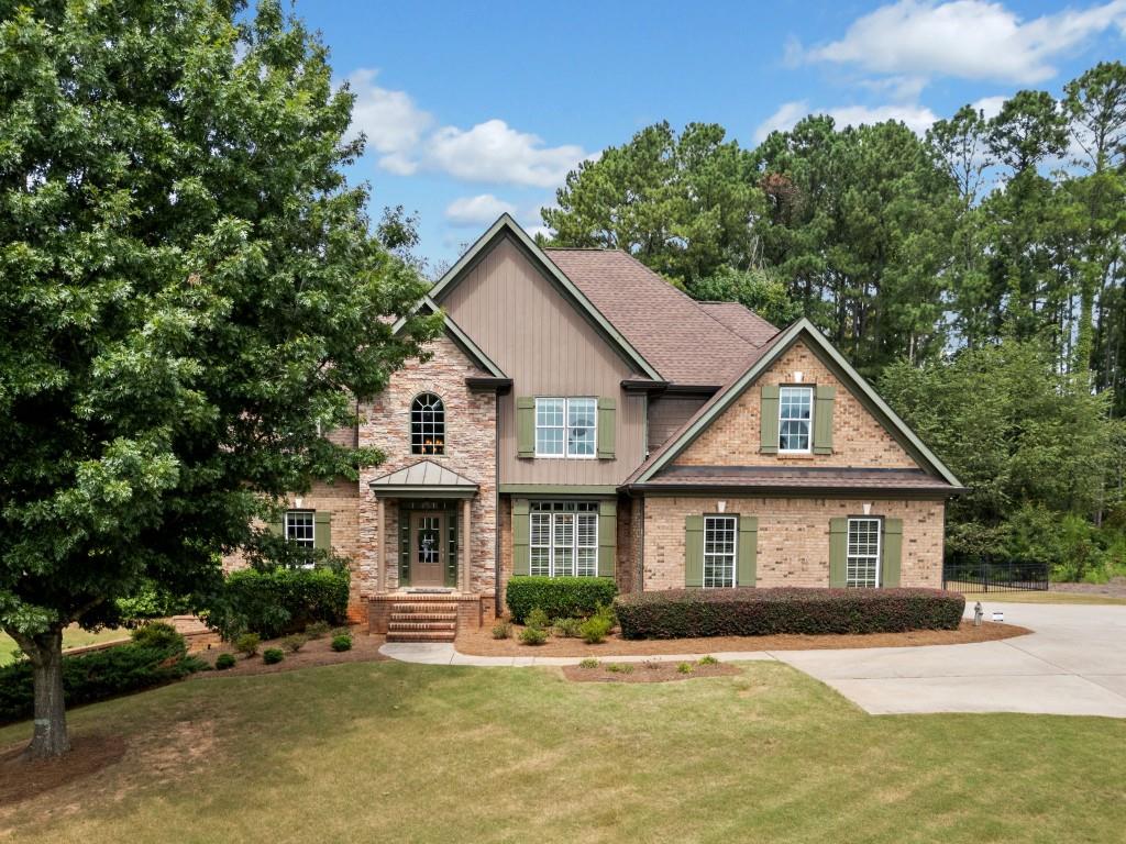 a front view of a house with a yard