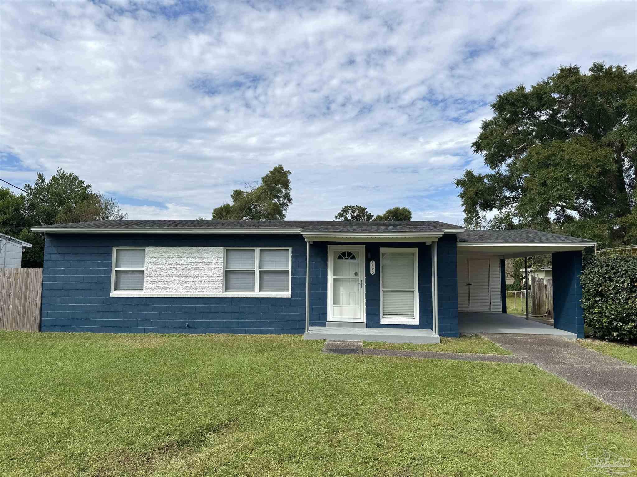 front view of a house with a yard