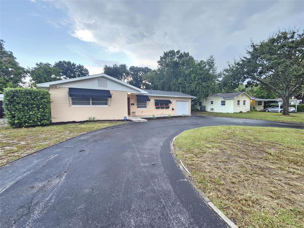 a view of a house with a yard