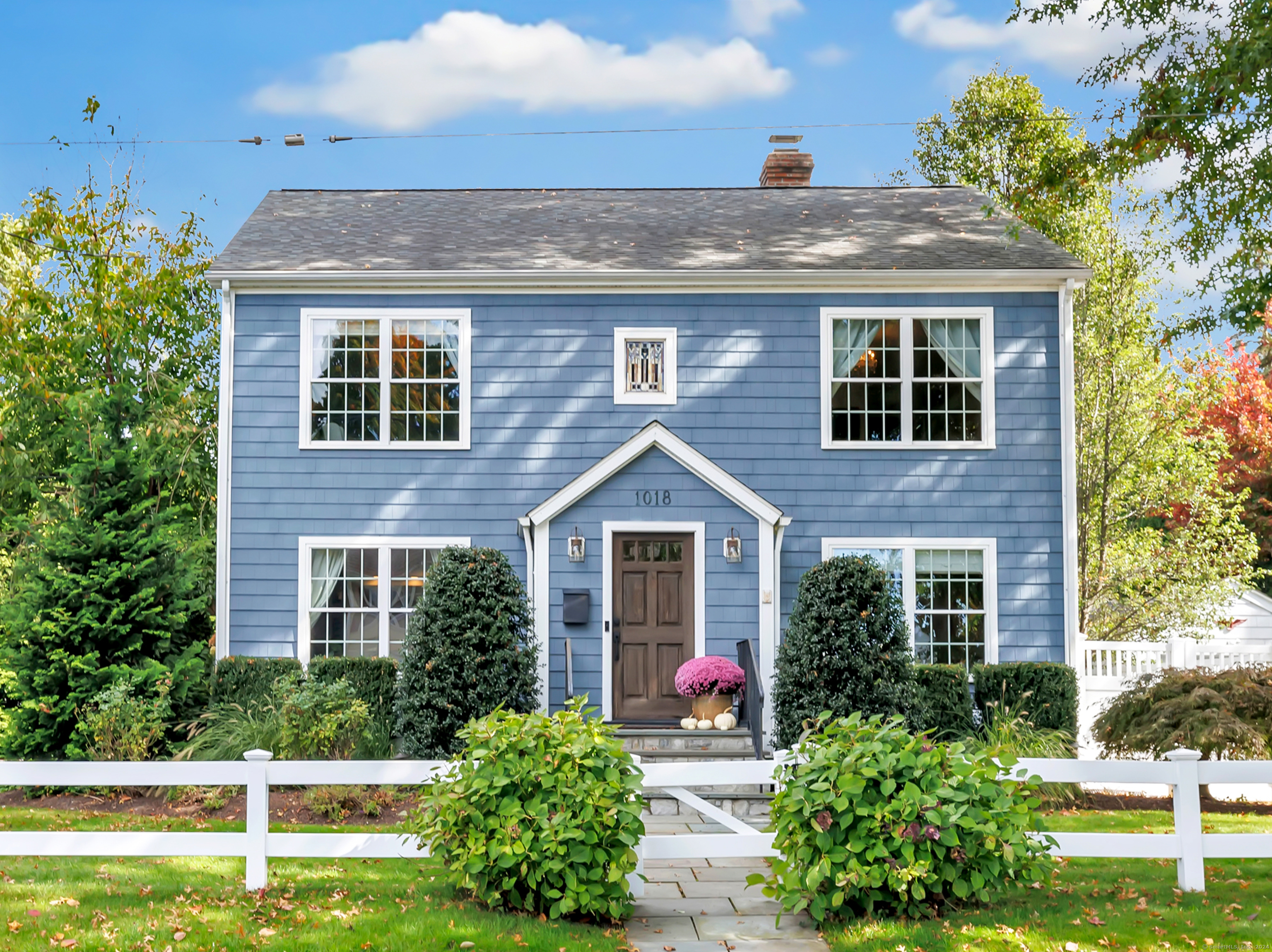 front view of a house with a yard