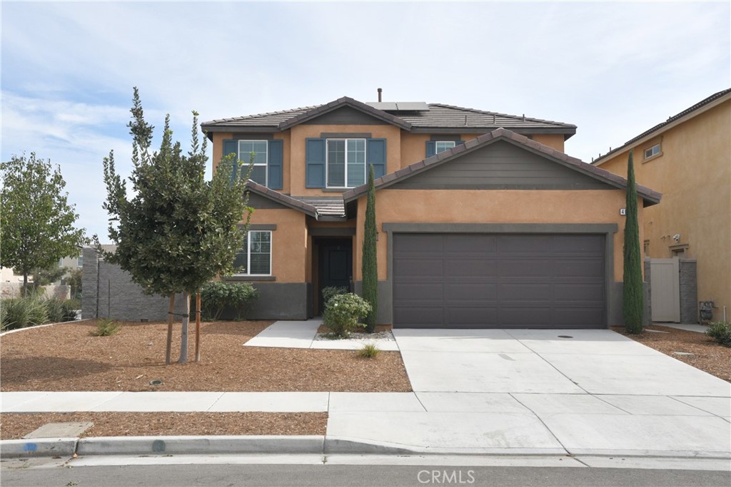 a front view of a house with garage