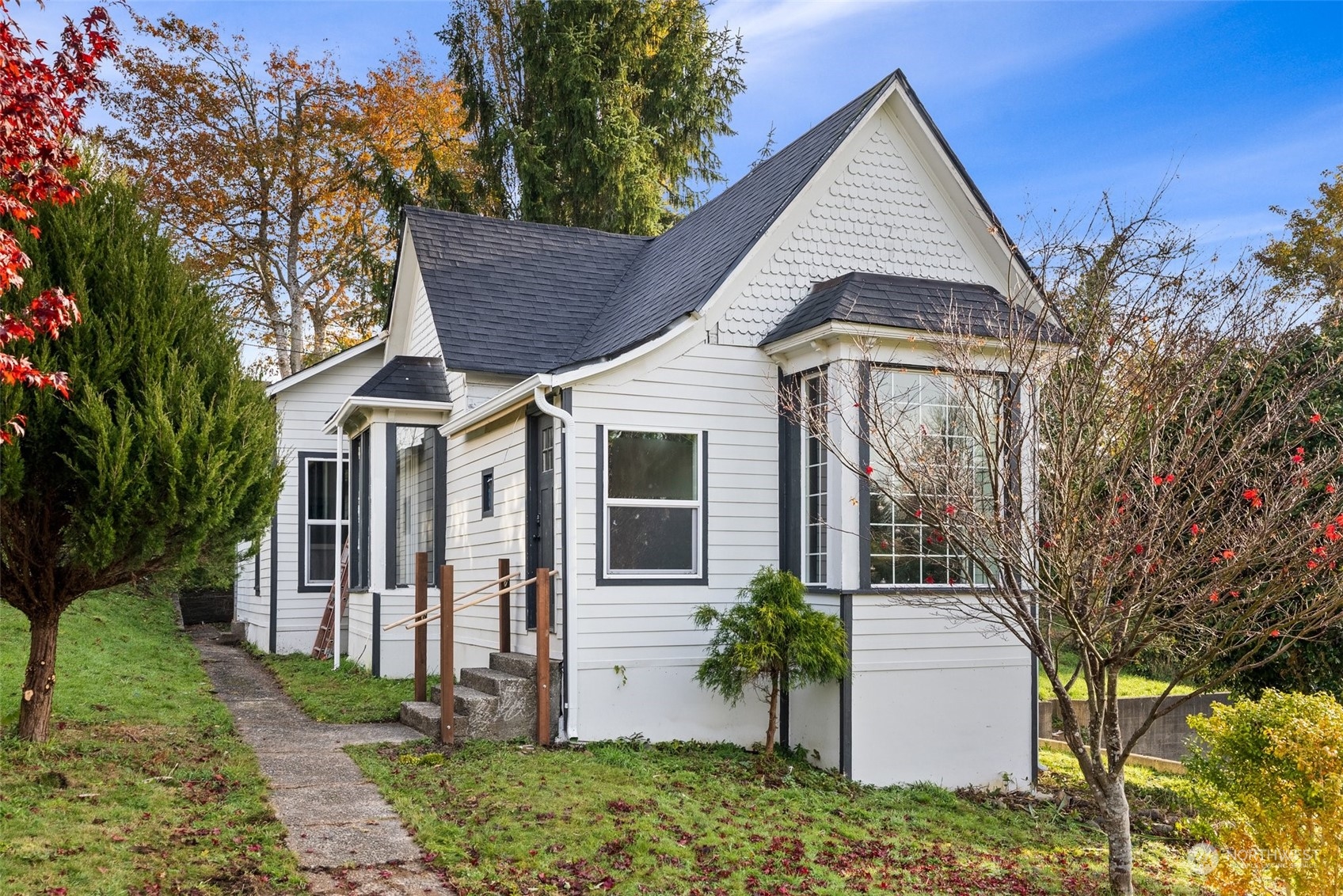 a front view of a house with garden