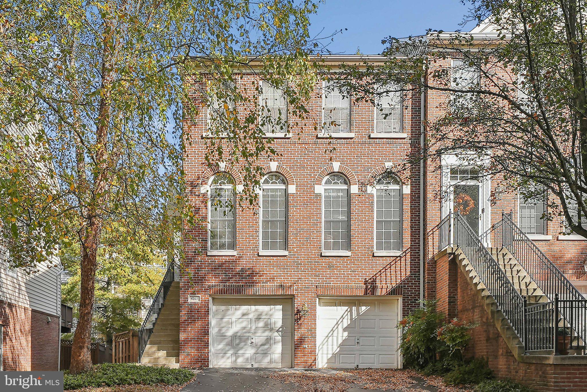 view of a brick building next to a yard