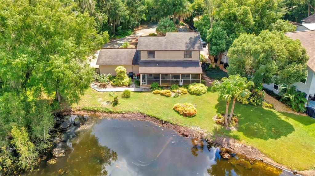 an aerial view of a house with a swimming pool