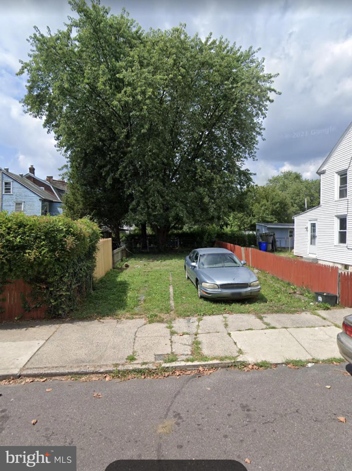 a view of a street with a house