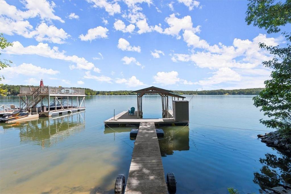 a front view of a house with a lake view