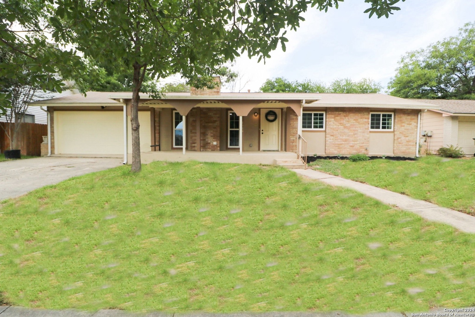 front view of a house with a yard