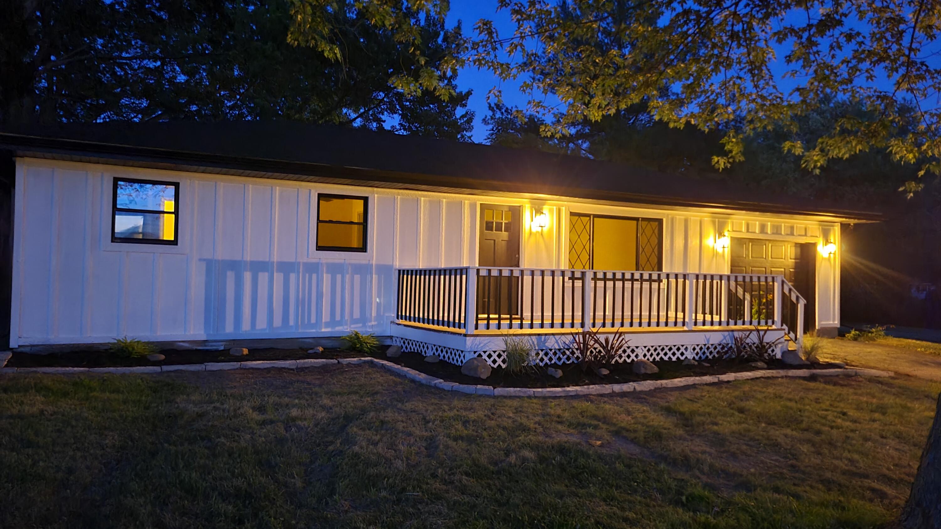 a view of a backyard with a small cabin