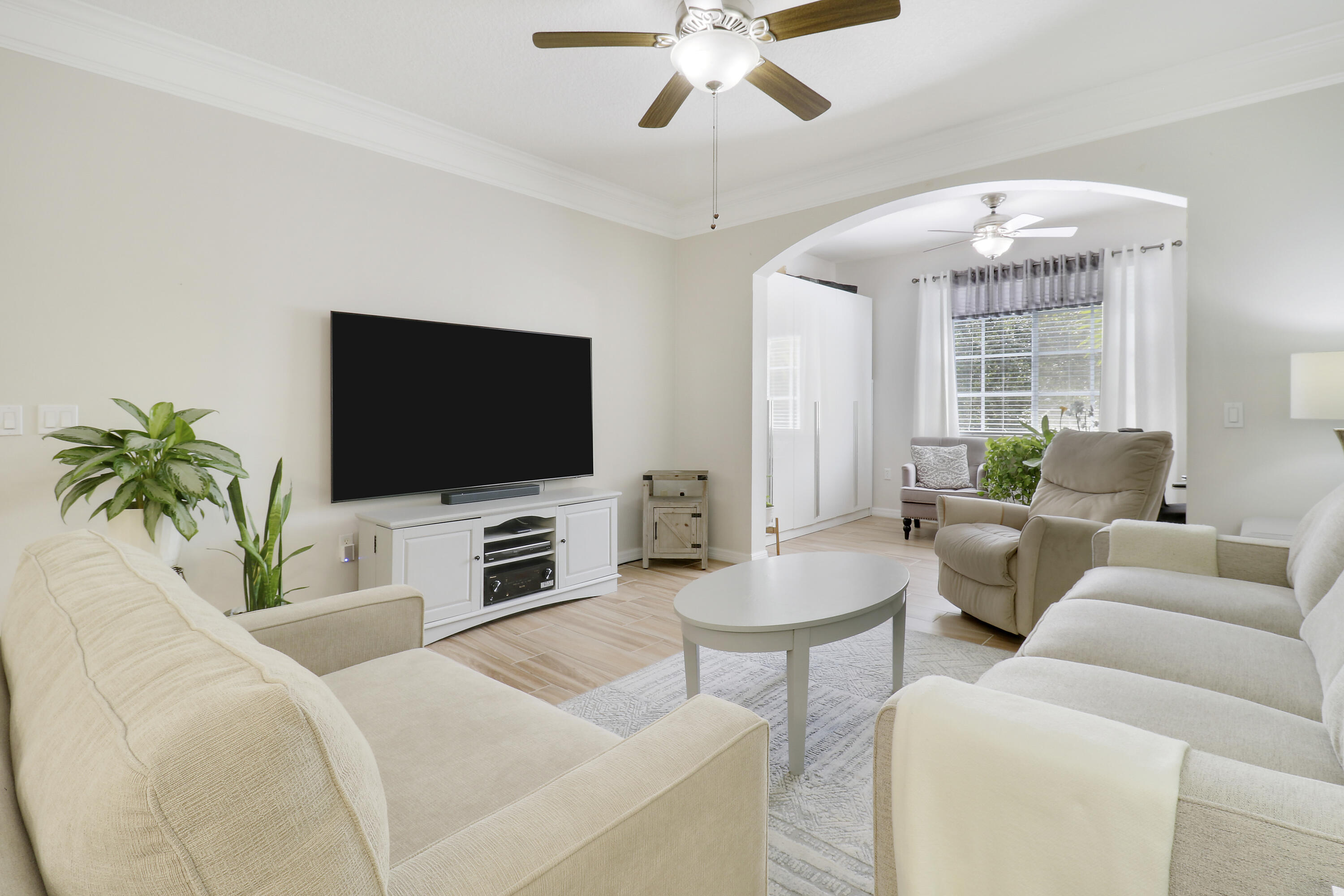 a living room with furniture and a flat screen tv