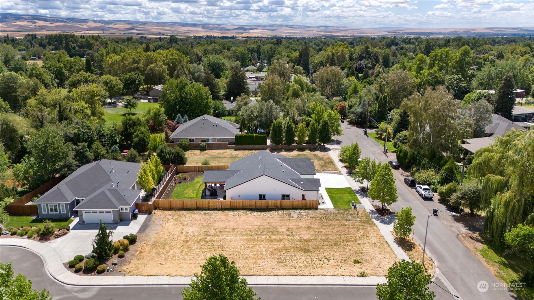 an aerial view of a house with a garden