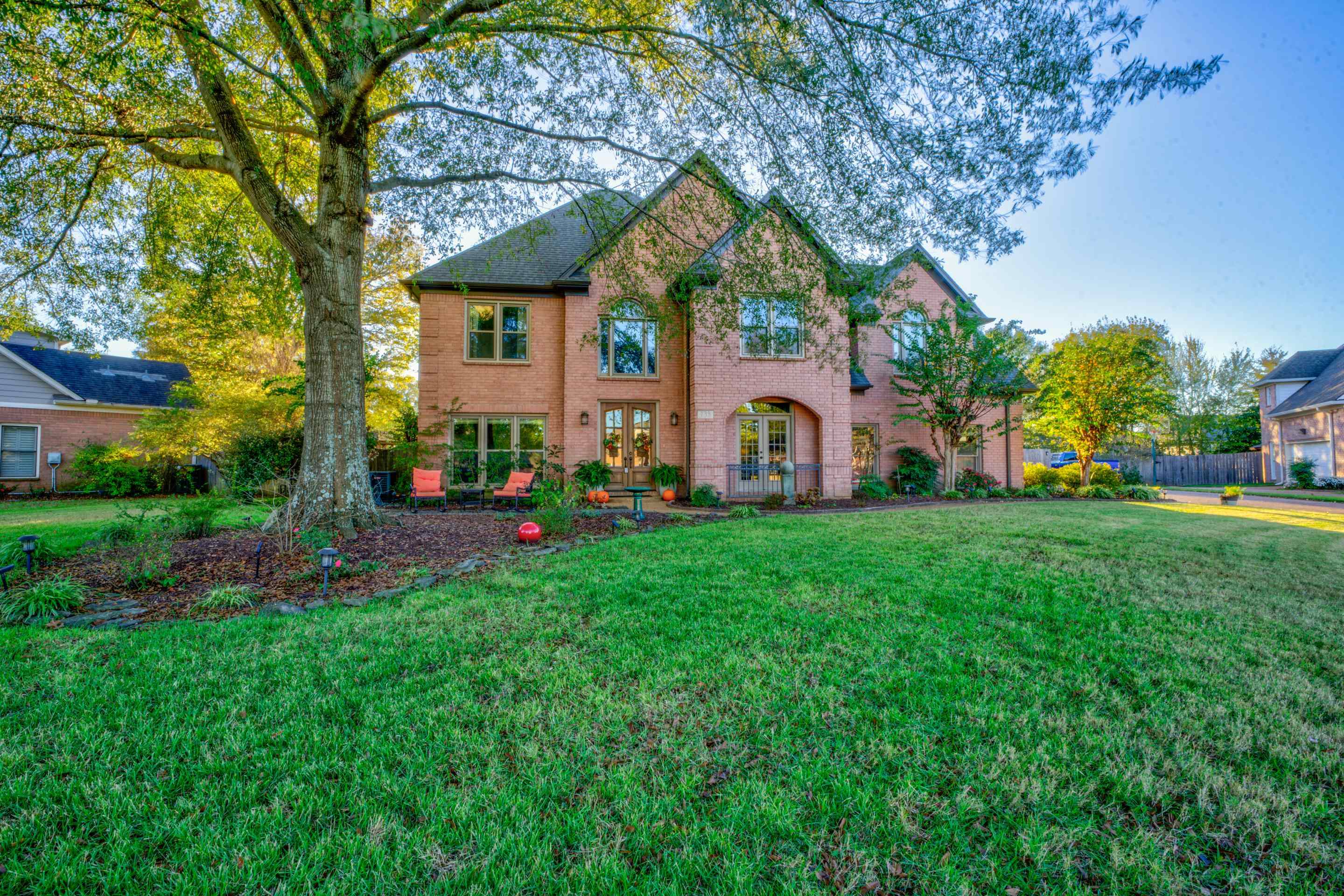 a front view of a house with garden