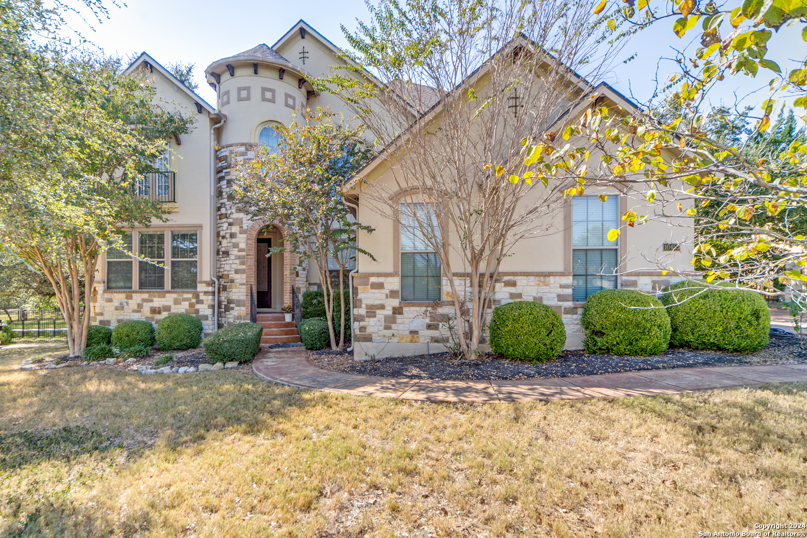 a front view of a house with a yard