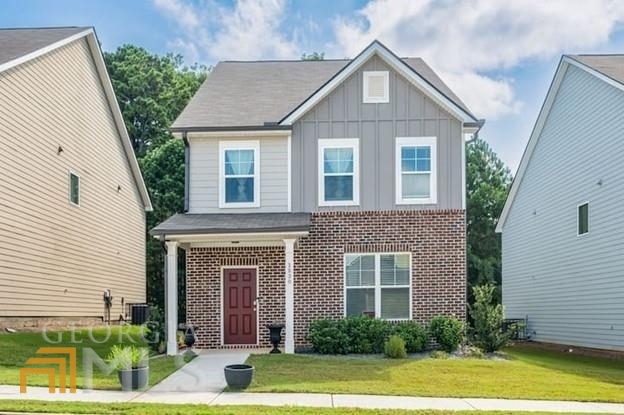 a front view of a house with a yard