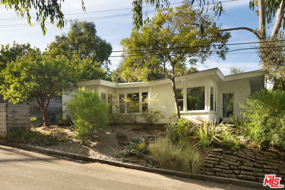 a view of a house with a garden