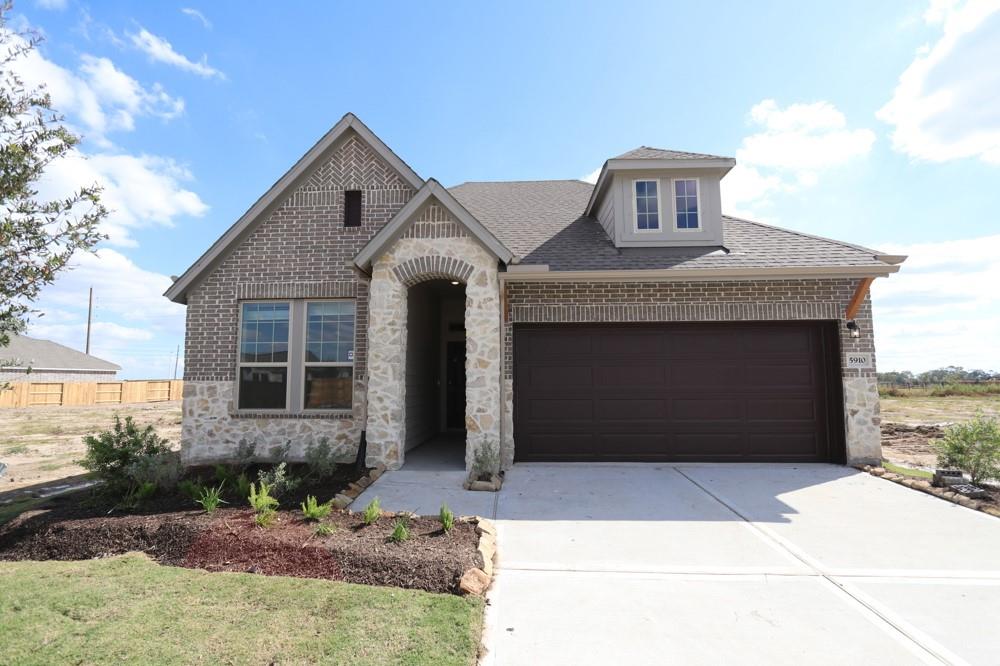 a front view of a house with yard