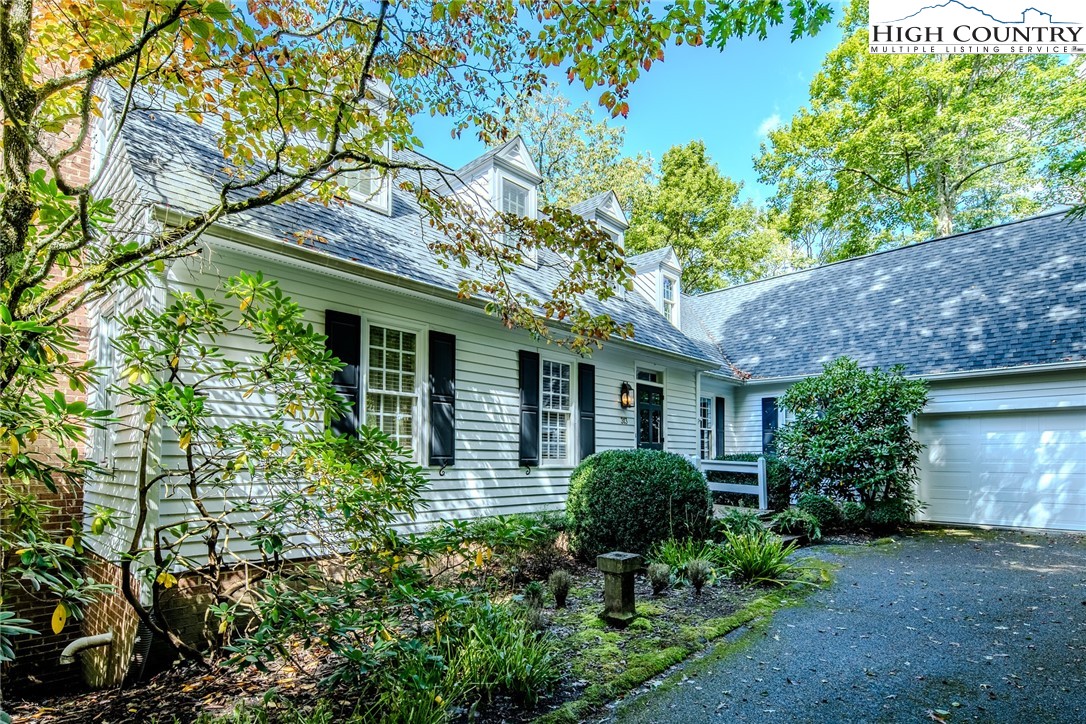 a house with a tree in front of it