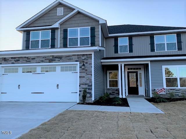 a front view of a house with yard