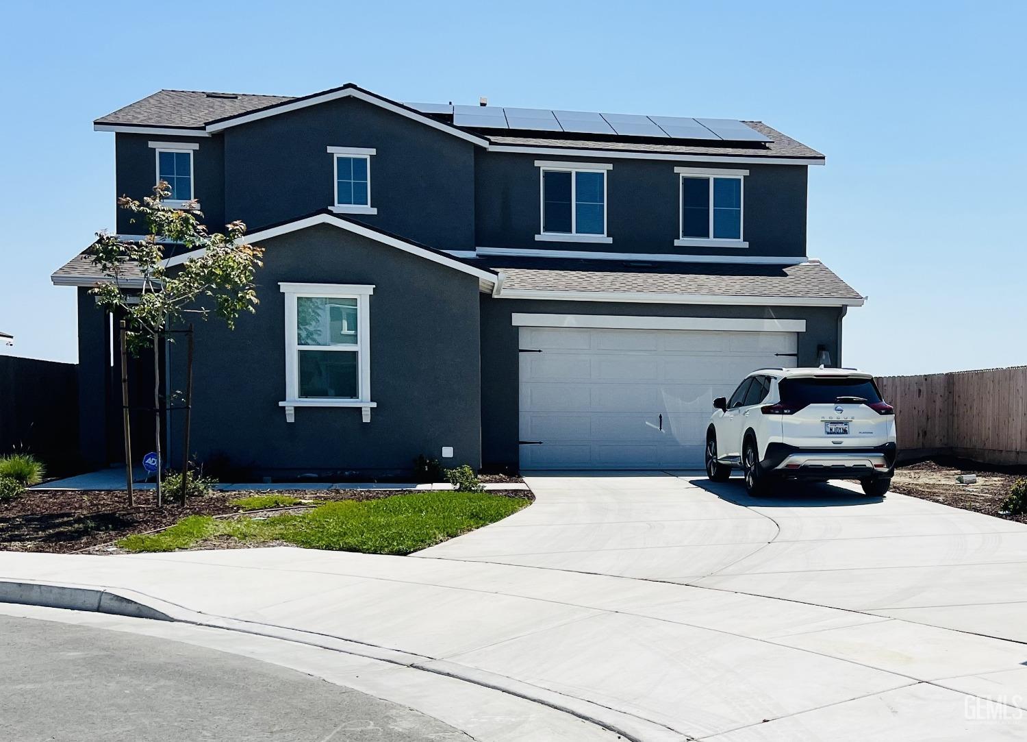 a car parked in front of a house