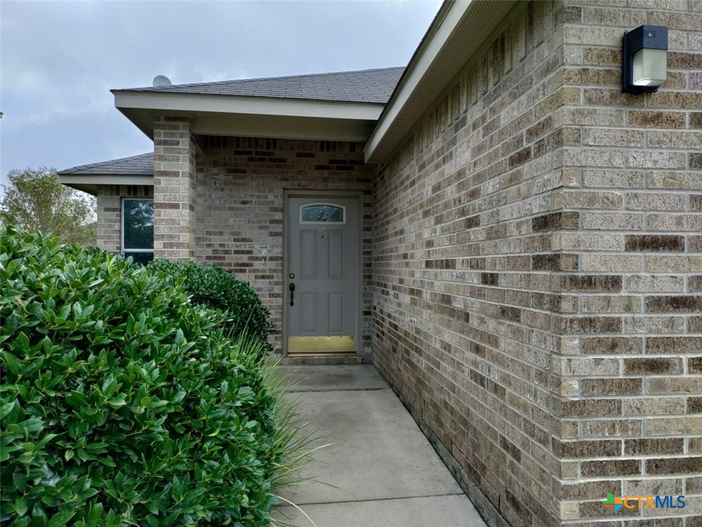 a front view of a house with stairs