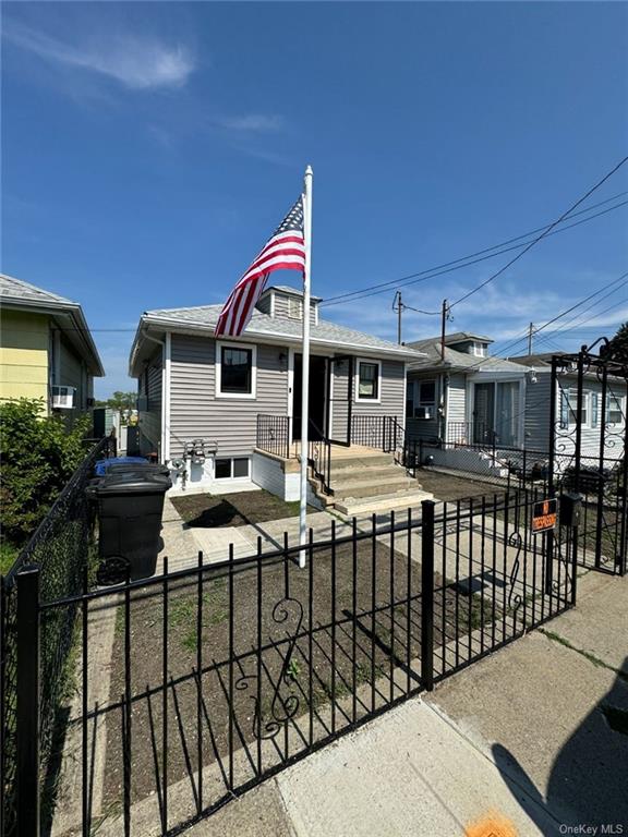 a view of house with a deck and furniture