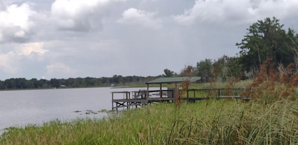 a view of a lake with houses in the back