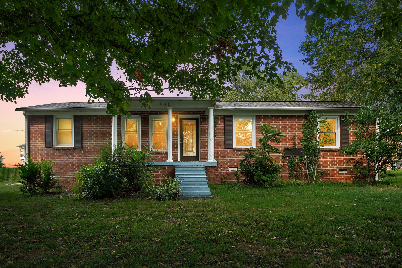 a front view of a house with garden