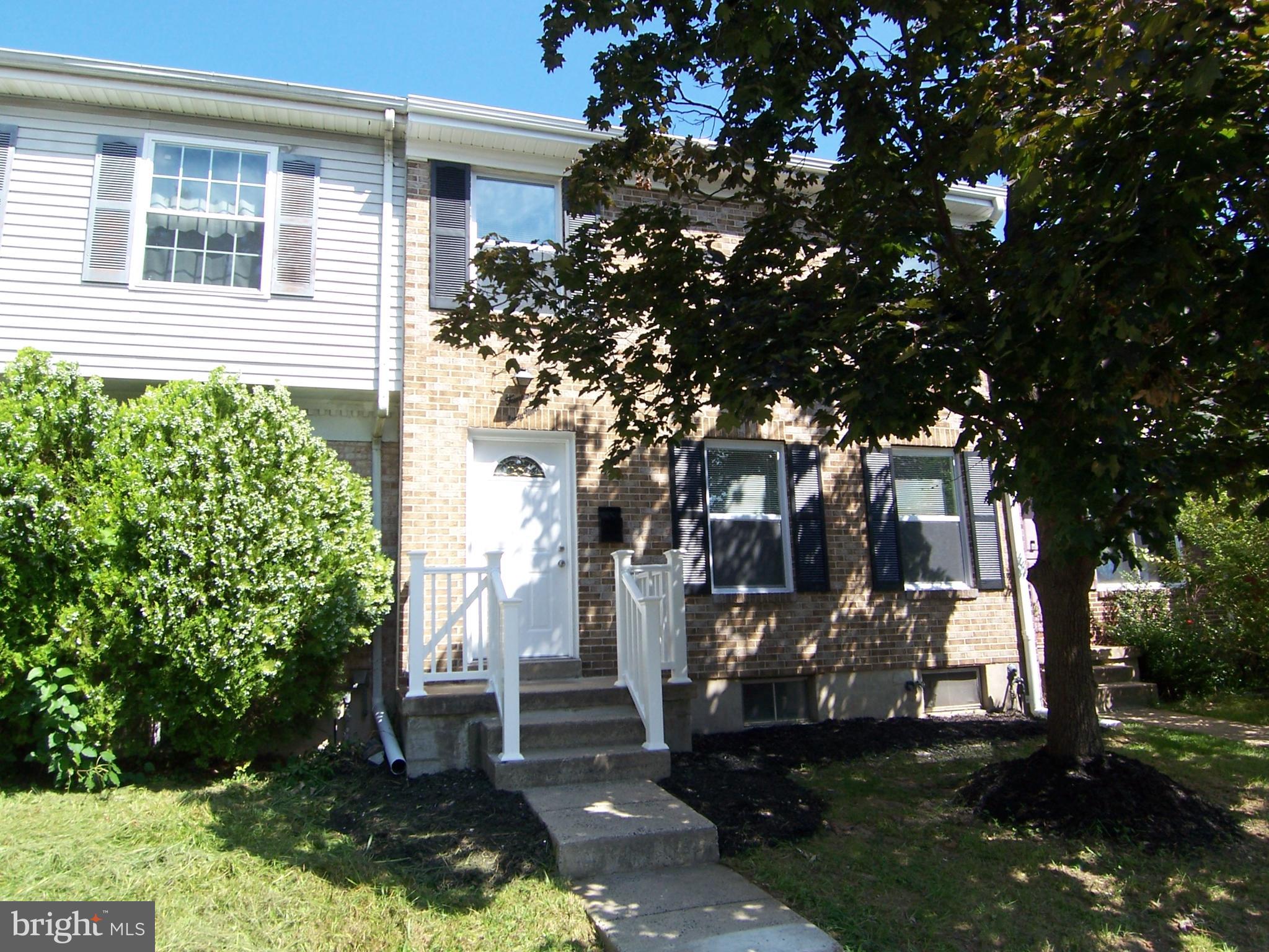 a view of house with yard