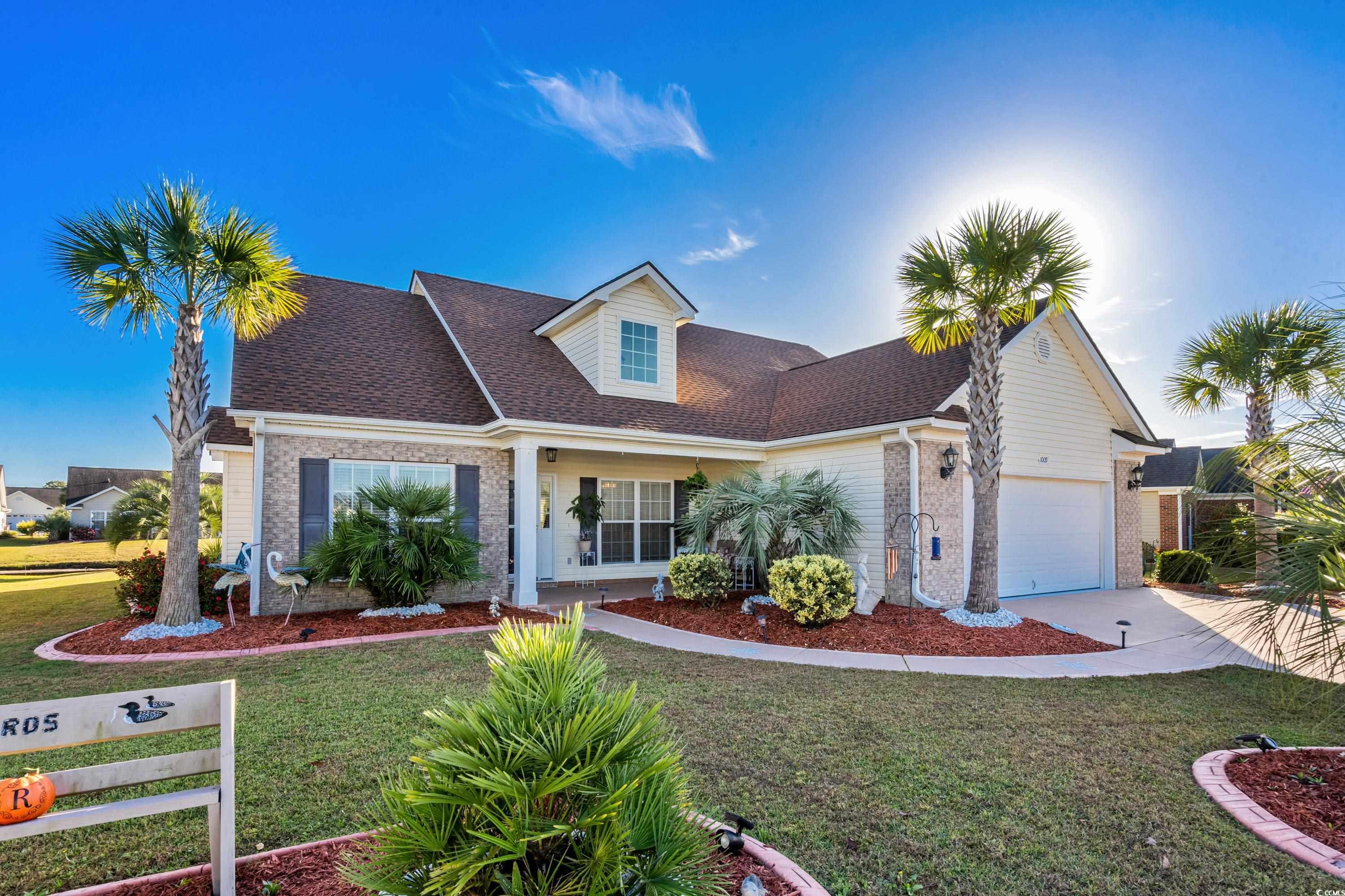 View of front of house featuring a front yard and