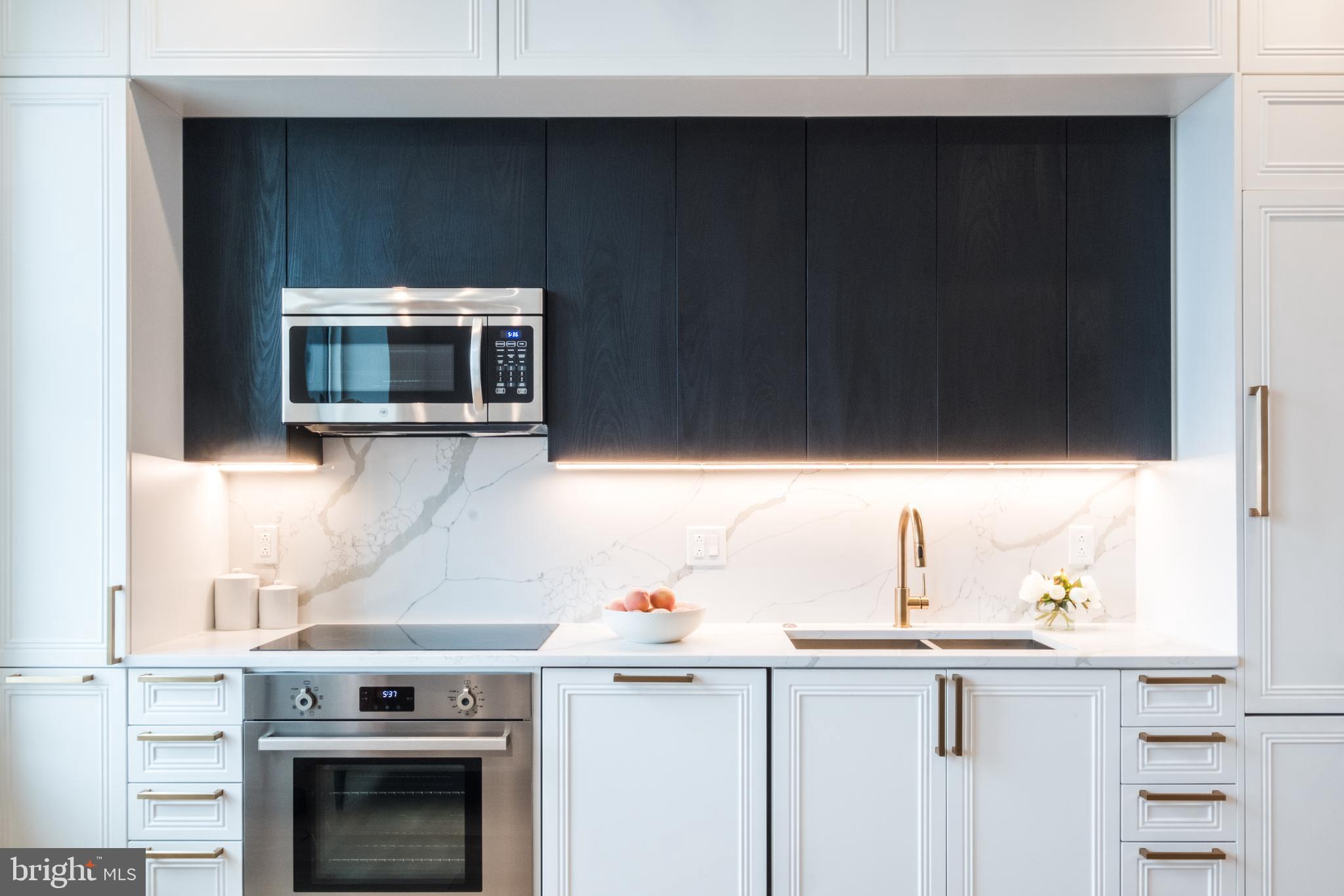 a kitchen with a sink and microwave