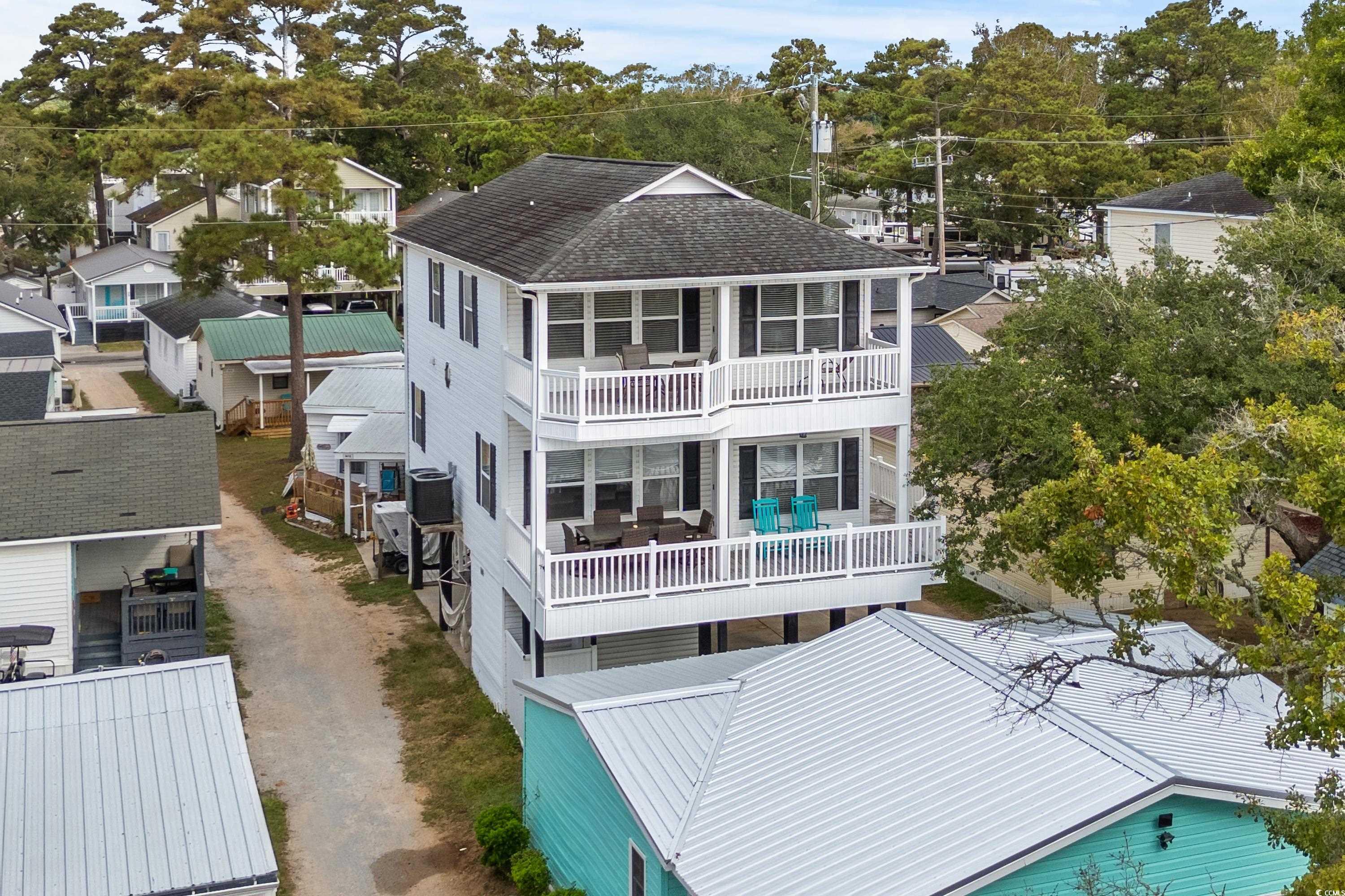 Rear view of property featuring a balcony