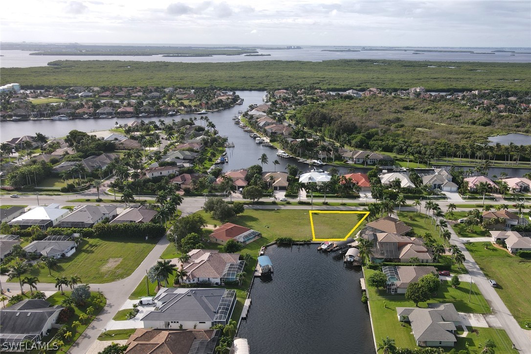 an aerial view of a house with a lake view