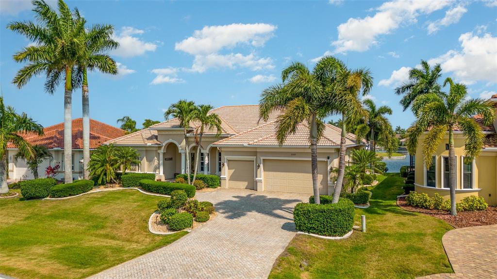 a front view of a house with yard and green space