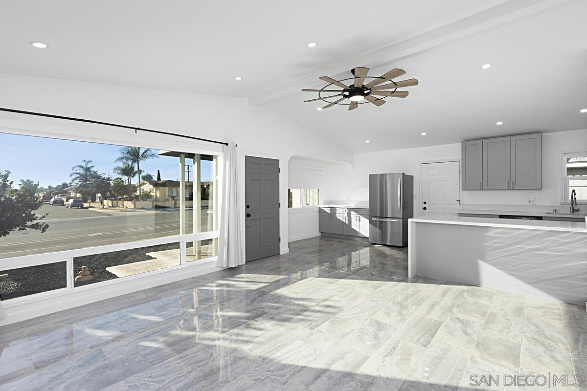 a view of a kitchen and a stove top oven