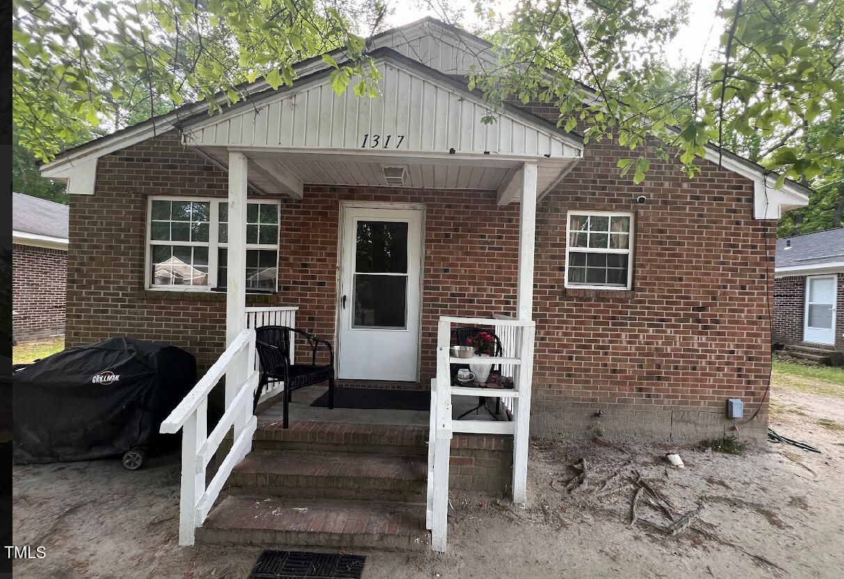 a front view of a house with stairs