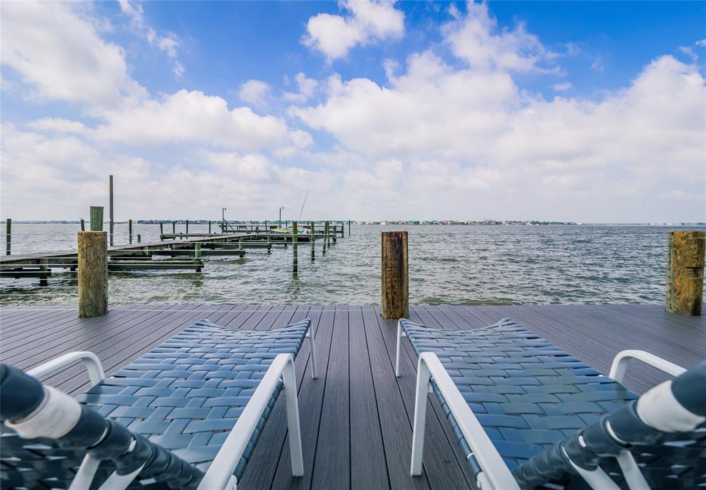 a view of a balcony with wooden floor