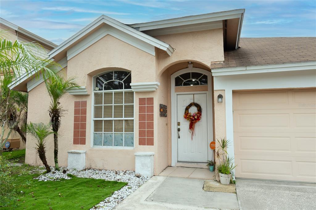 a front view of a house with garden