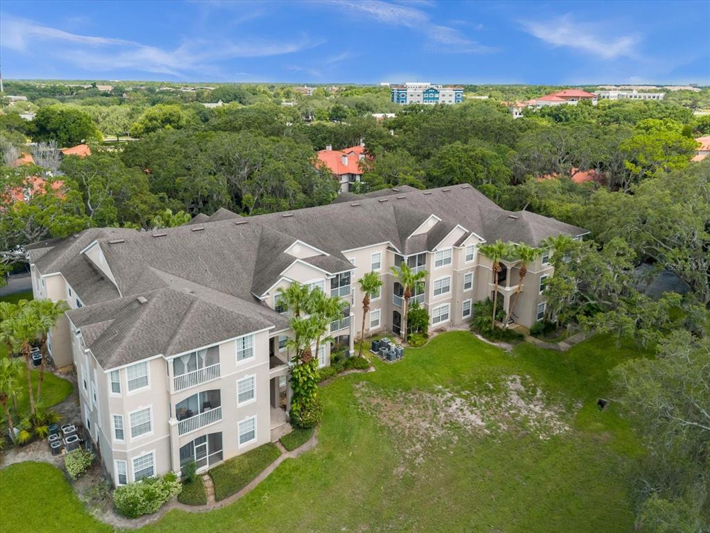 an aerial view of house with yard and mountain