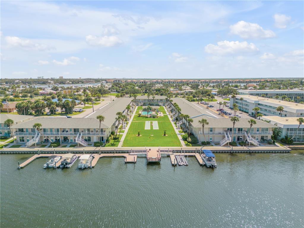 an aerial view of residential houses with outdoor space